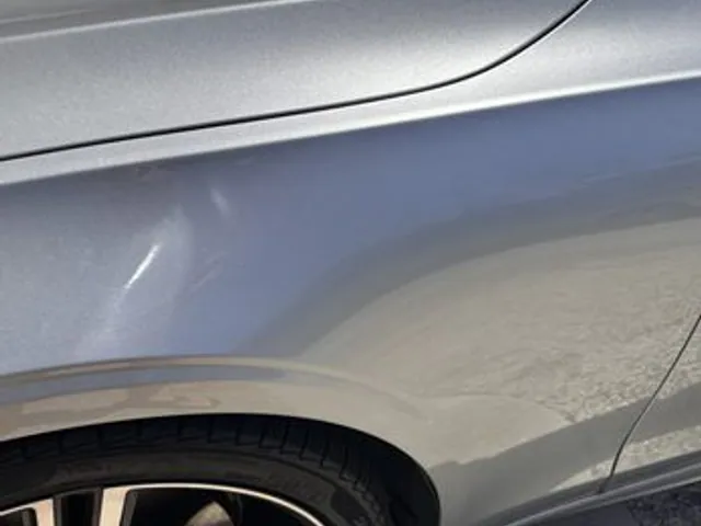 Silver SUV quarter panel after dent repair