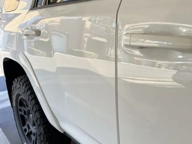 White SUV rear quarter after dent repair