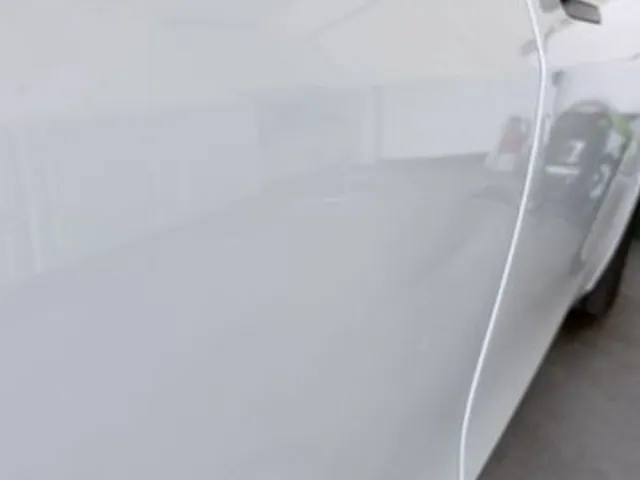 White car door after ding removal
