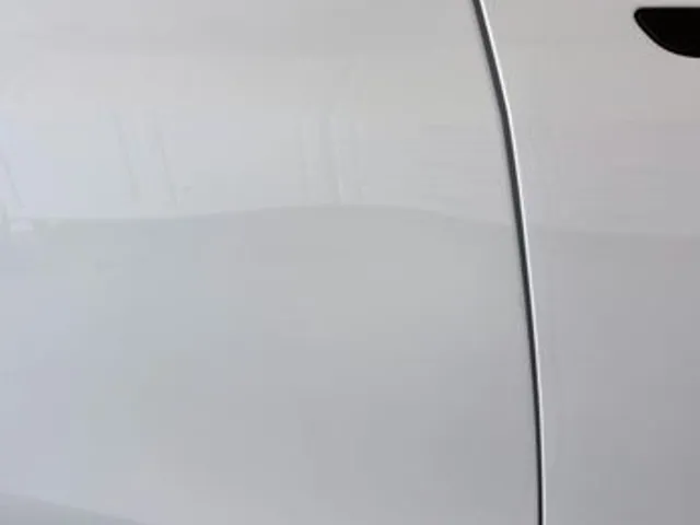 Silver car door after dent repair