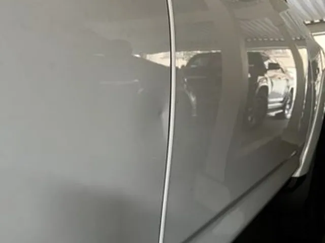 Silver car door after dent repair