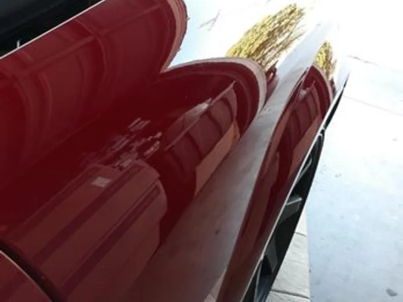 Red coupe body line after crease repair